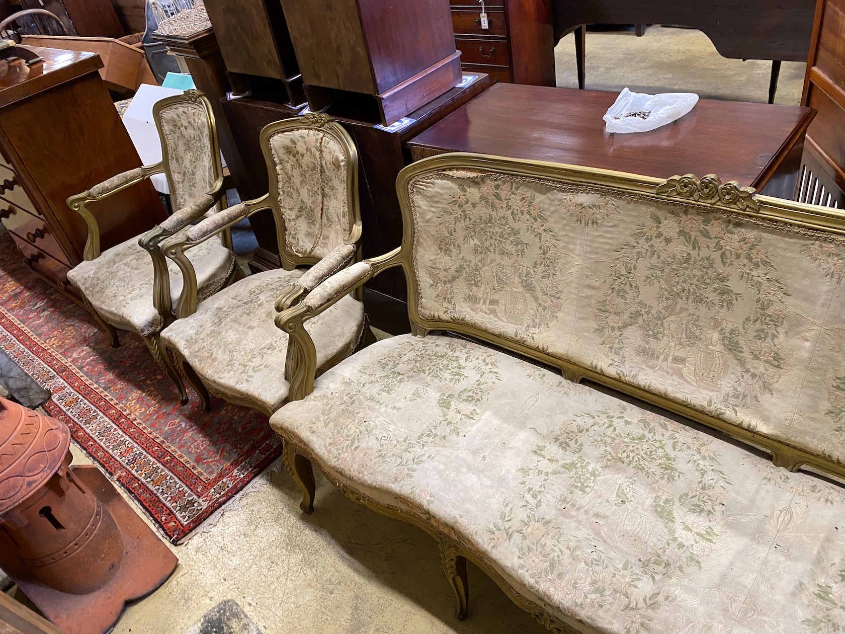 A Louis XVI style gilt framed three piece salon suite, settee length 176cm, depth 67cm, height 97cm